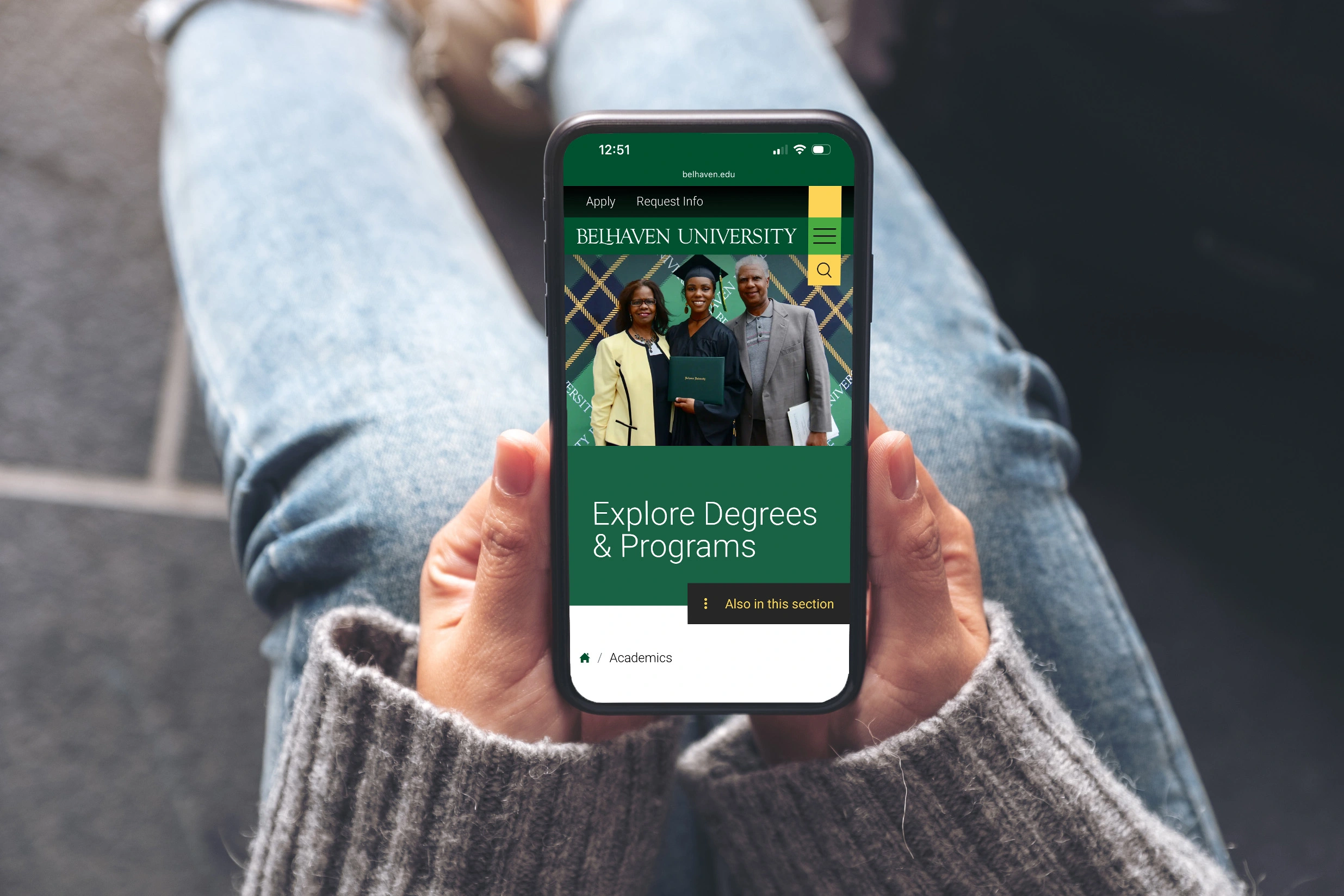 Belhaven University student holding mobile phone.